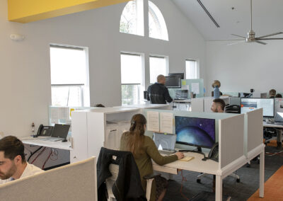 busy office full of workers working at desks